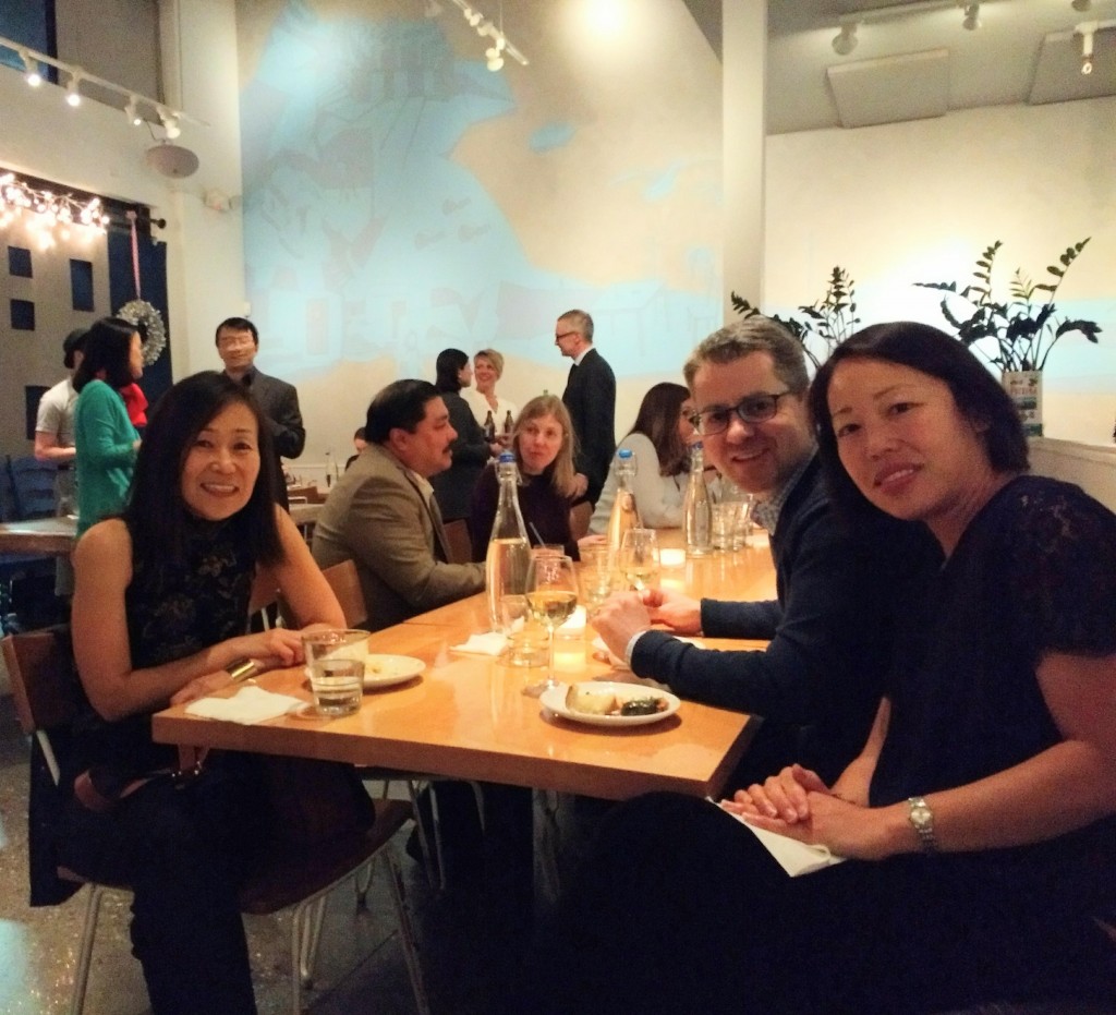 Faculty and staff seated around a table