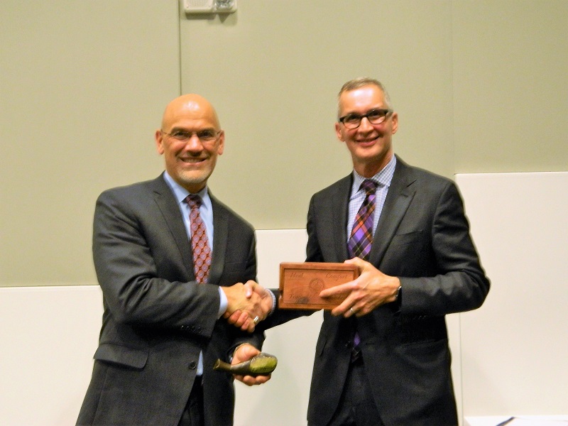 Dr. Uzzo receives the Geoduck from Dr. Wessells