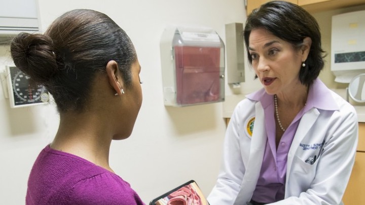 A doctor educates a patient
