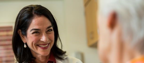 Dr. Sutherland with a patient