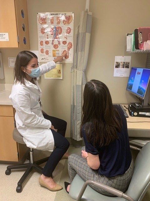Dr. Filippou with a patient